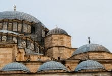 Detailed view of the cascading domes and stone walls of the Süleymaniye Mosque in Istanbul